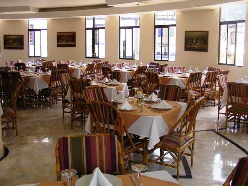 Casa Morales Hotel Internacional Y Centro De Convenciones Ибаге Экстерьер фото The dining room at the hotel