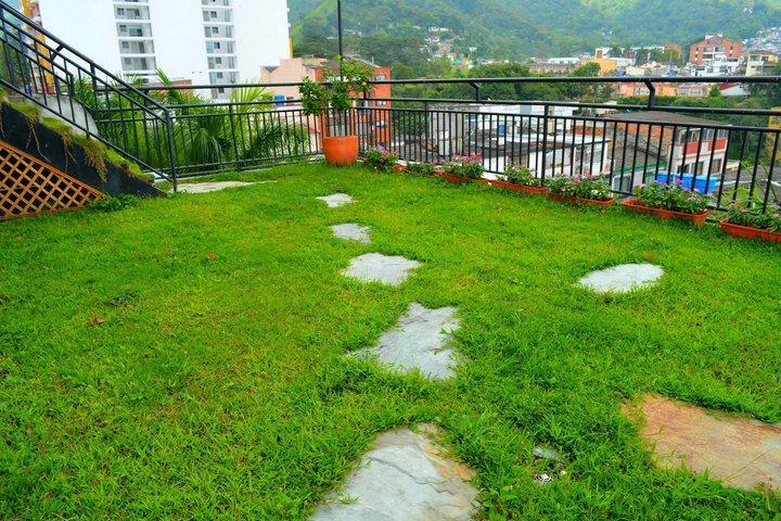Casa Morales Hotel Internacional Y Centro De Convenciones Ибаге Экстерьер фото A rooftop garden in Kathmandu, Nepal